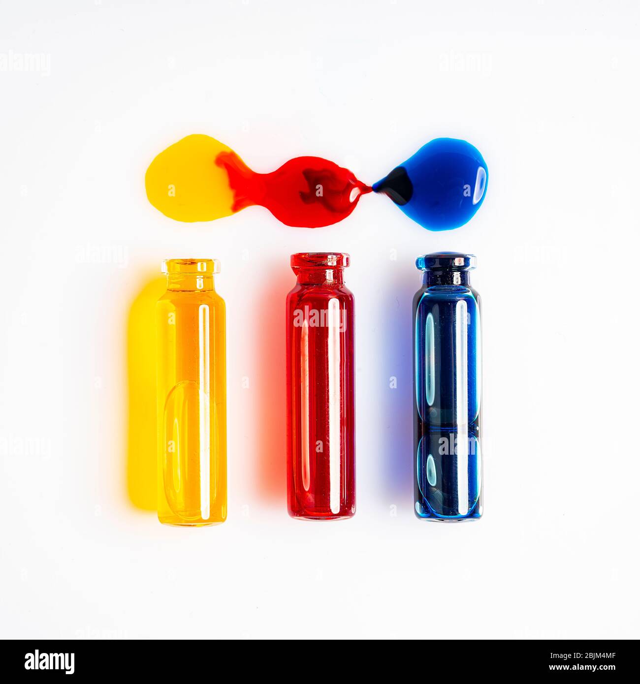 the fall of glass flasks with the contamination between colored liquids Stock Photo