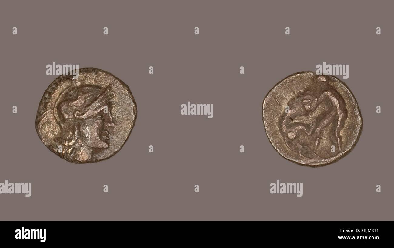 Author: Ancient Greek. Obol (Coin) Depicting the Goddess Athena - 334 (or earlier)/302 BC - Greek. Silver. 334 BC'302 BC. Taranto. Stock Photo