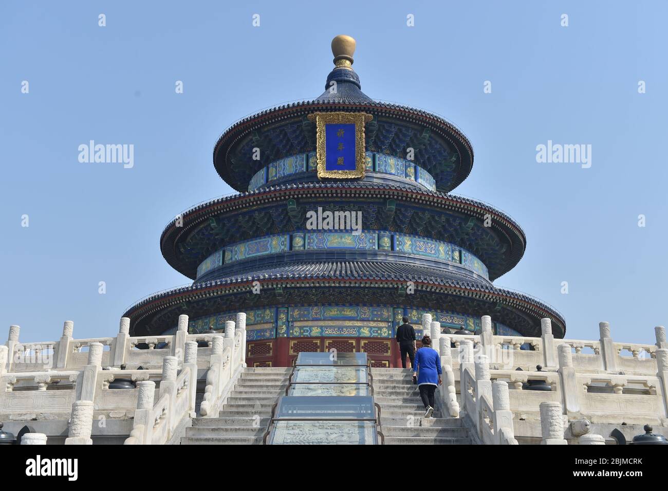 Beijing, China. 29th Apr, 2020. Tourists visit the Hall of Prayer for Good Harvest at the Temple of Heaven in Beijing, capital of China, April 29, 2020. The Temple of Heaven reopened its three main building groups to the public on Wednesday. And the reopened grounds can be accessed by a limited number of visitors via online booking. Credit: Peng Ziyang/Xinhua/Alamy Live News Stock Photo