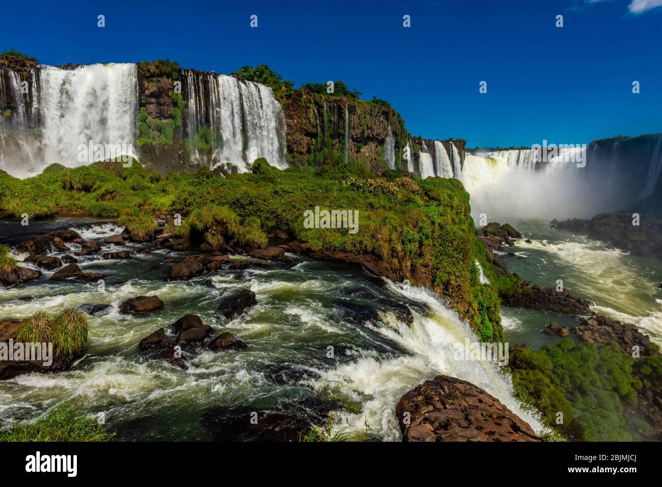Iguazu Falls (Iguacu in Portugese), on the border of Brazil and Argentina. It is one of the New 7 Wonders of Nature and is a UNESCO World Heritage Stock Photo