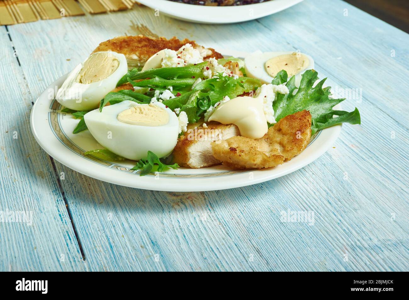 Chicken schnitzel Caesar, Crunchy, munchy schnitzel and creamy, crispy caesar salad Stock Photo