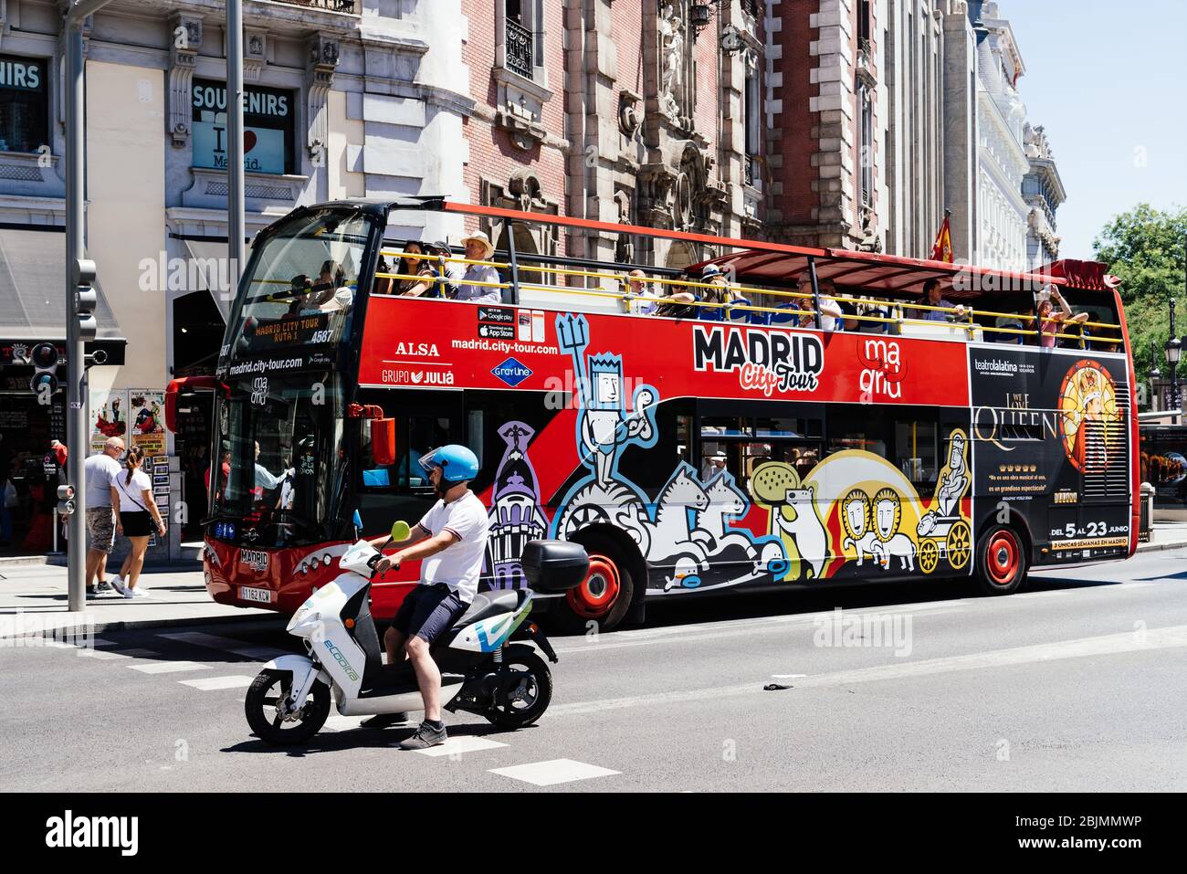 Madrid, Spain - June 1, 2019: Hop-On Hop-Off tour bus. Madrid City Tour in Gran Via Avenue. Stock Photo