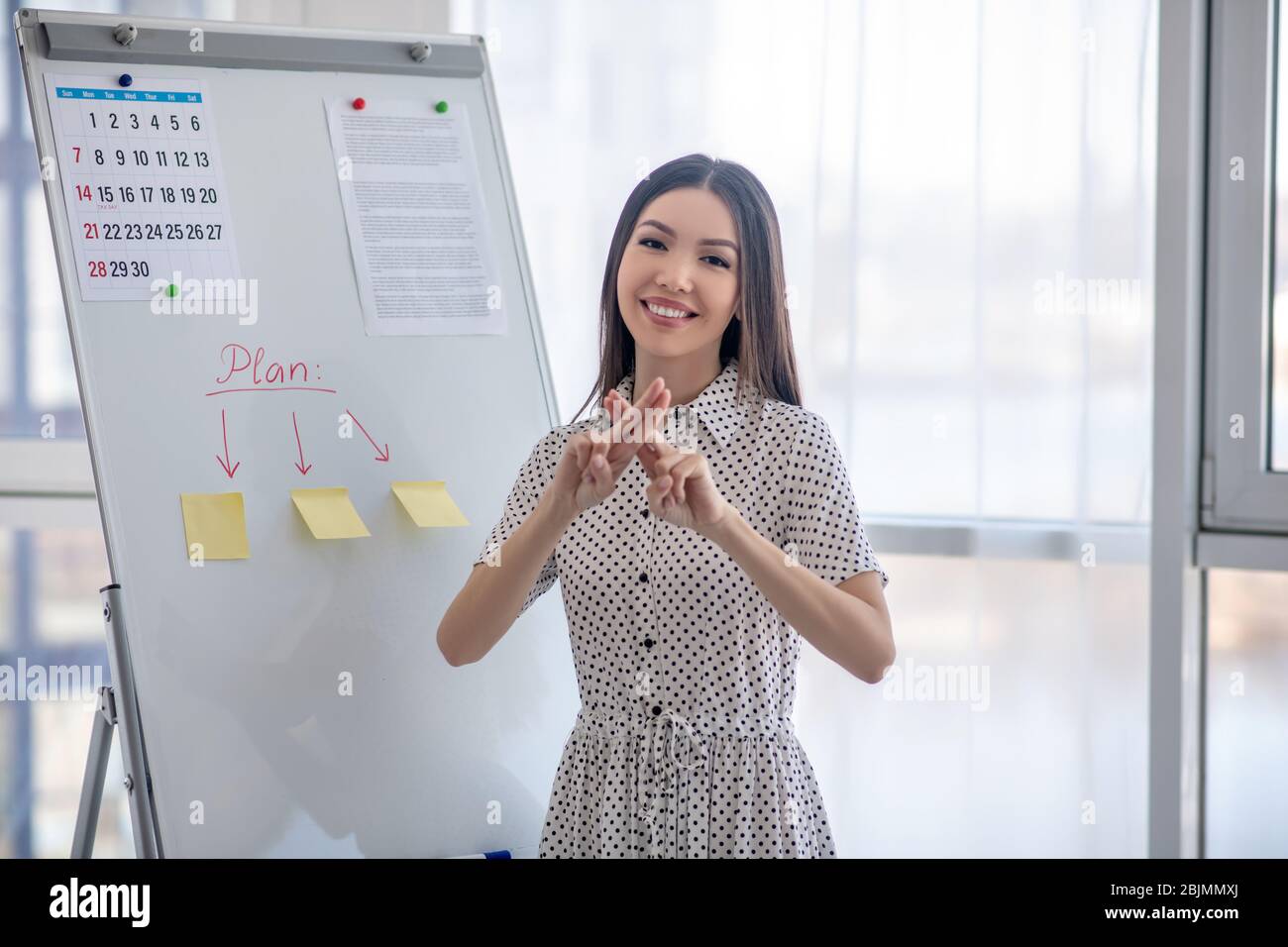Young sign language interpreter translating webinar for deaf people