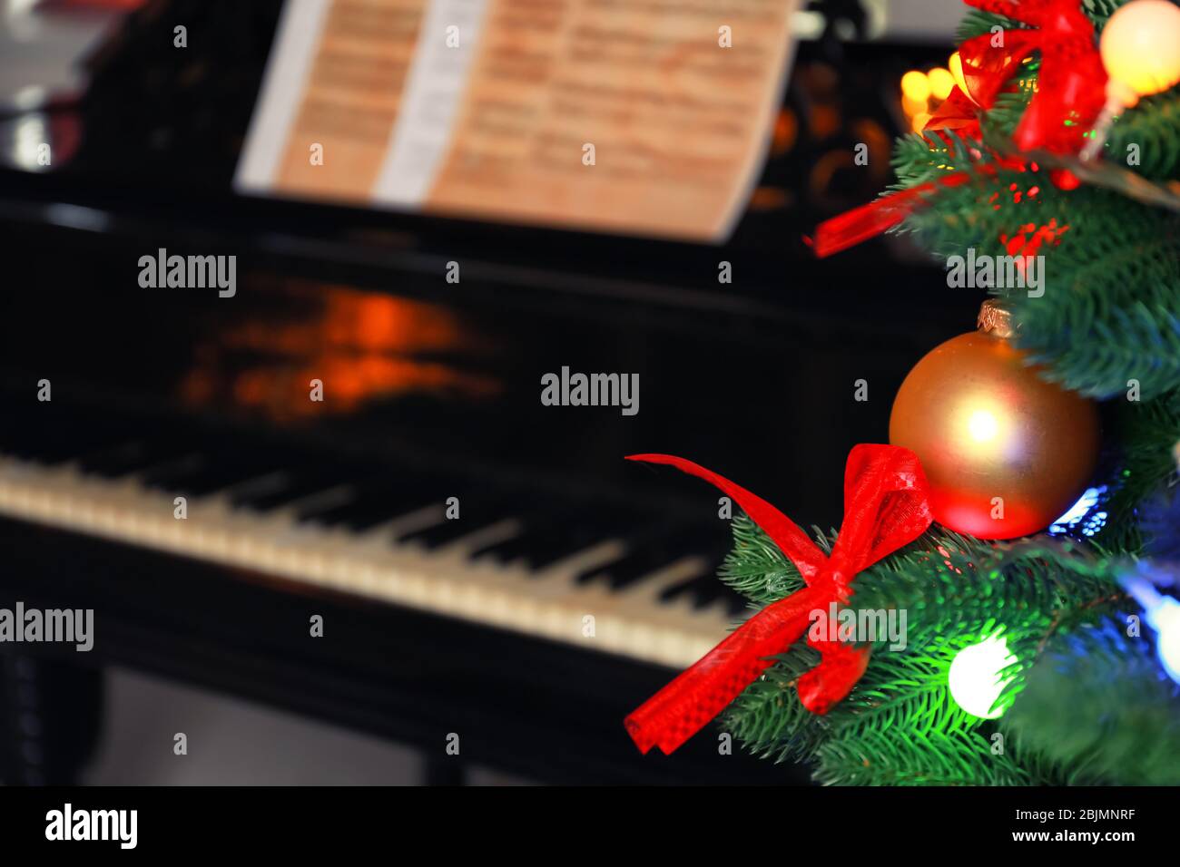 Christmas tree and piano on background Stock Photo