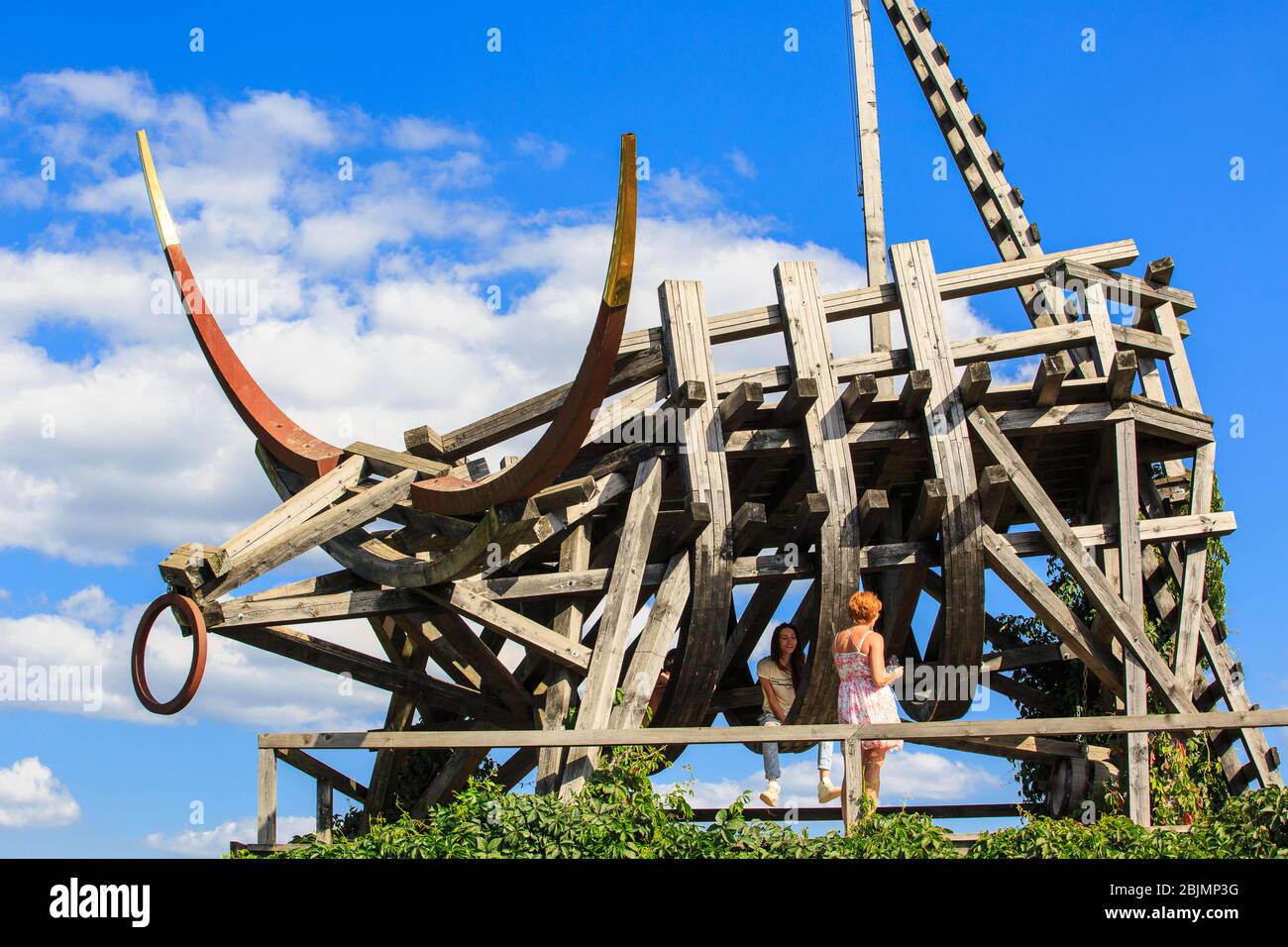 People on Art-object Gold Plated Bull in Nikola-Lenivec, Archstoyanie park Stock Photo