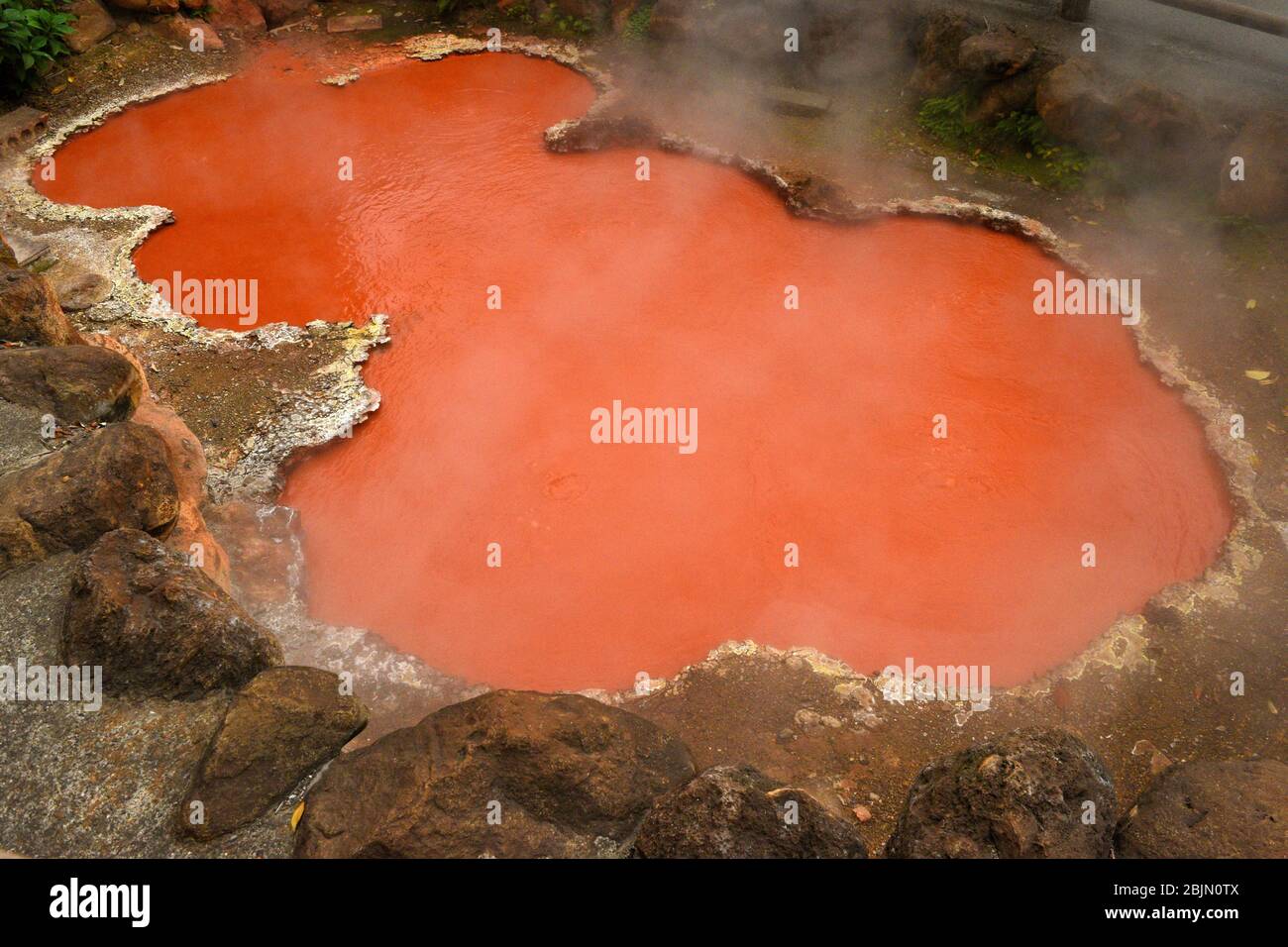 A view of the steam rising from the hot springs at one of the 8 Hells of Beppu, natural pools of