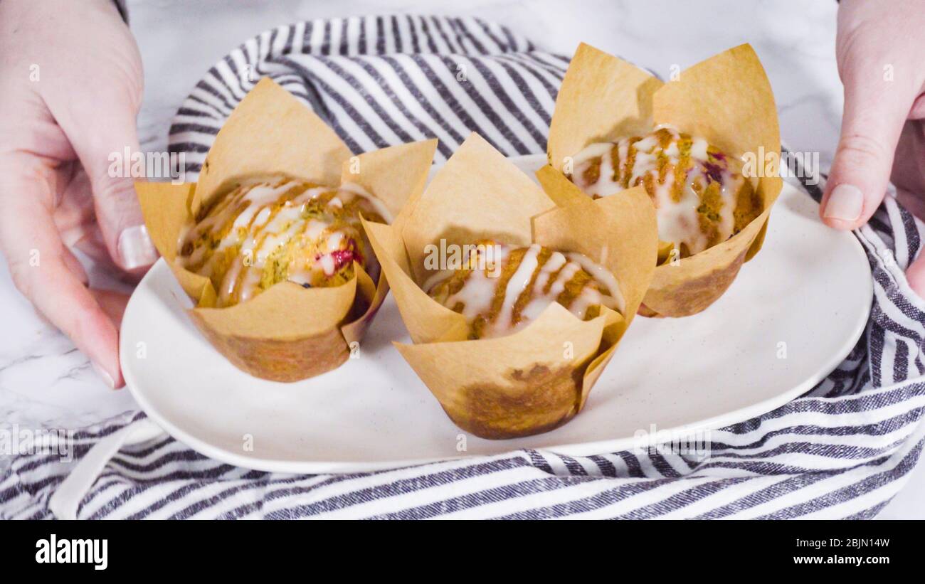 https://c8.alamy.com/comp/2BJN14W/step-by-step-freshly-baked-cranberry-muffins-in-brown-tulip-muffin-liners-2BJN14W.jpg