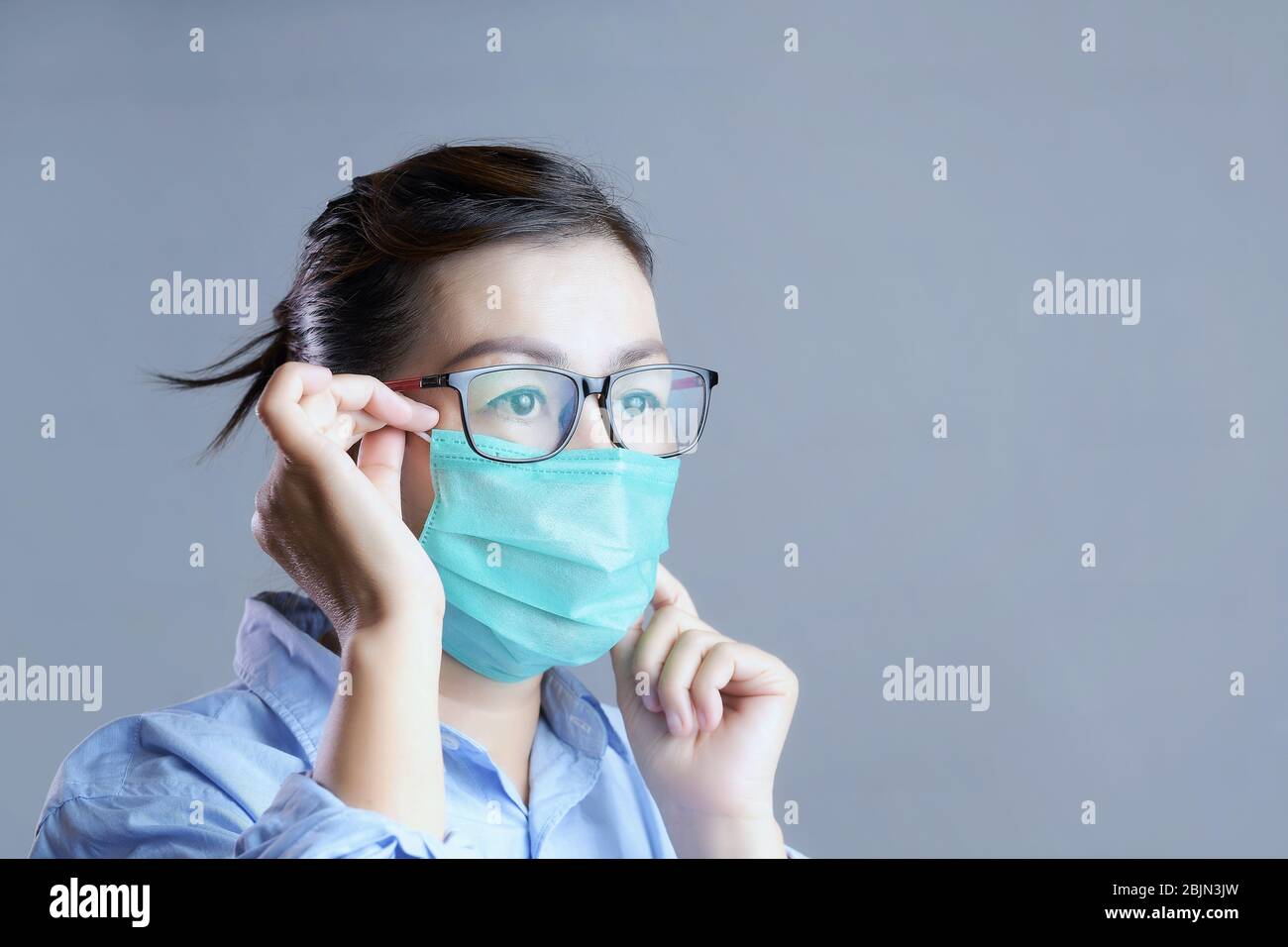 Portrait of a woman wearing a face mask Stock Photo