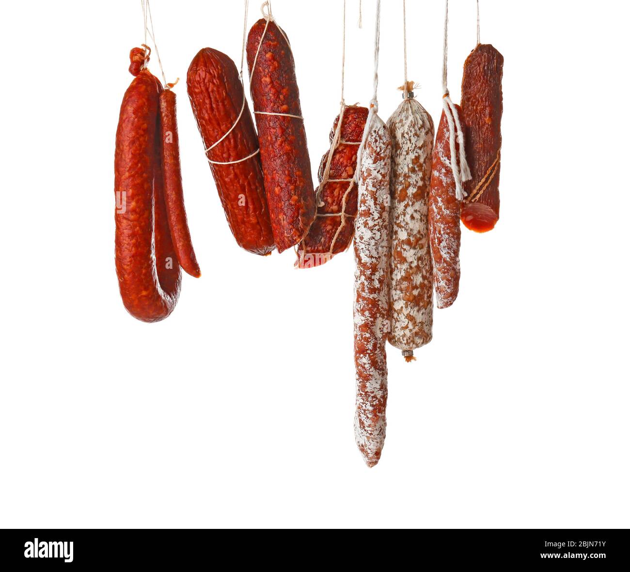 Delicious sausages hanging on white background Stock Photo Alamy