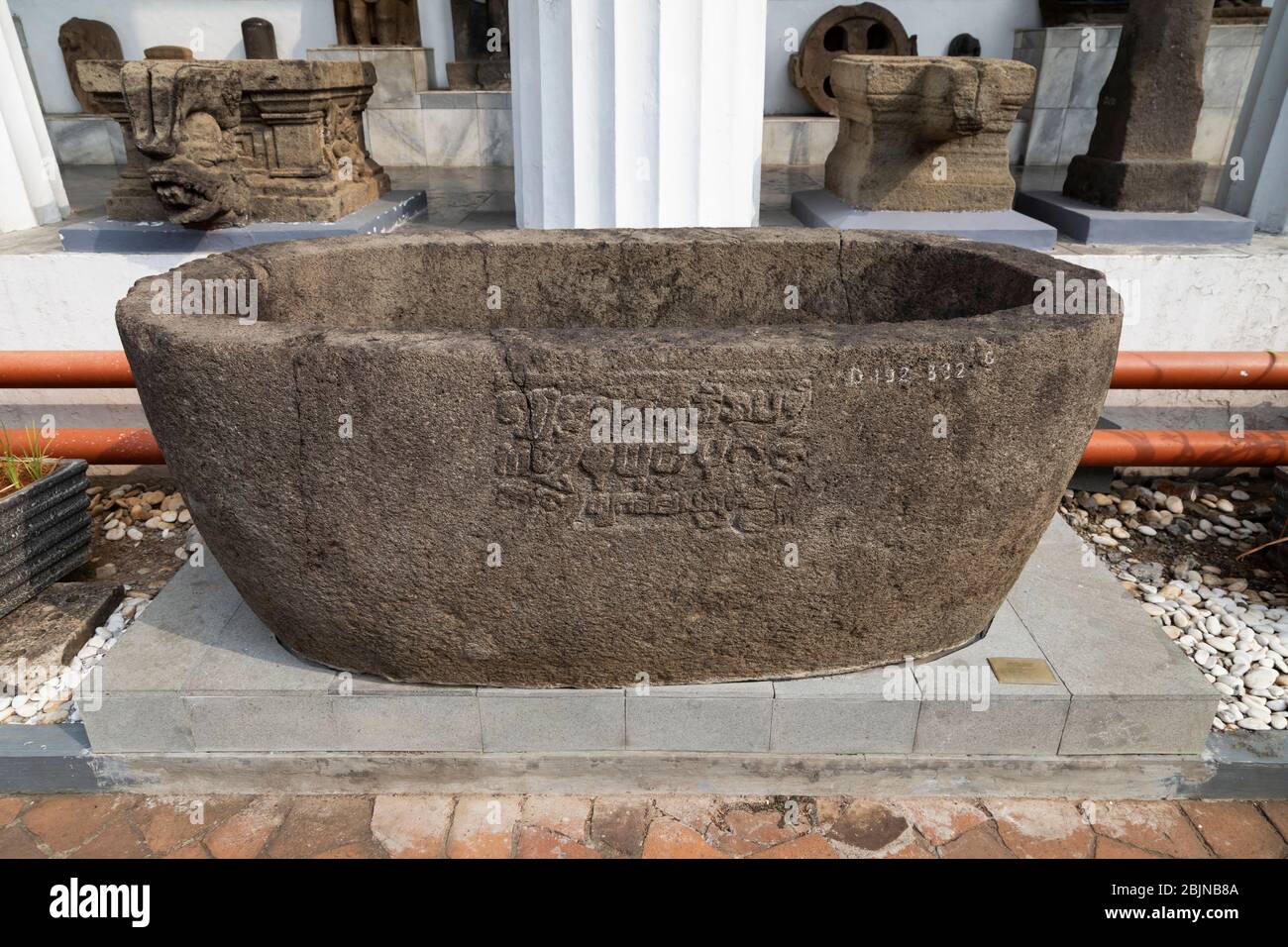 Jakarta, Indonesia - July 14, 2019: Ancient deposit or stone vase of enormous dimensions and inscriptions, National Museum of Indonesia. Stock Photo