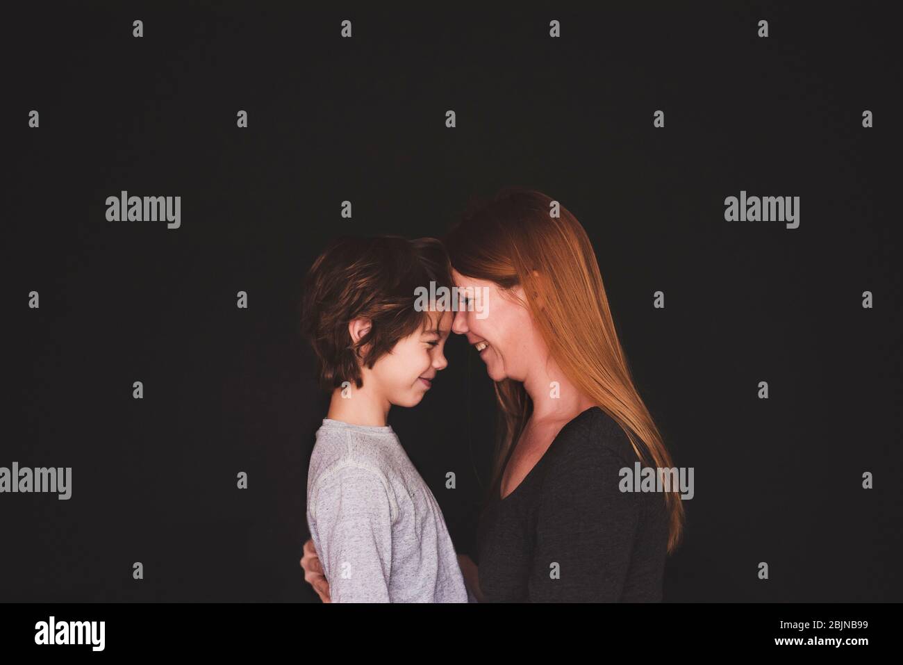Portrait of a mother standing face to face with her son Stock Photo