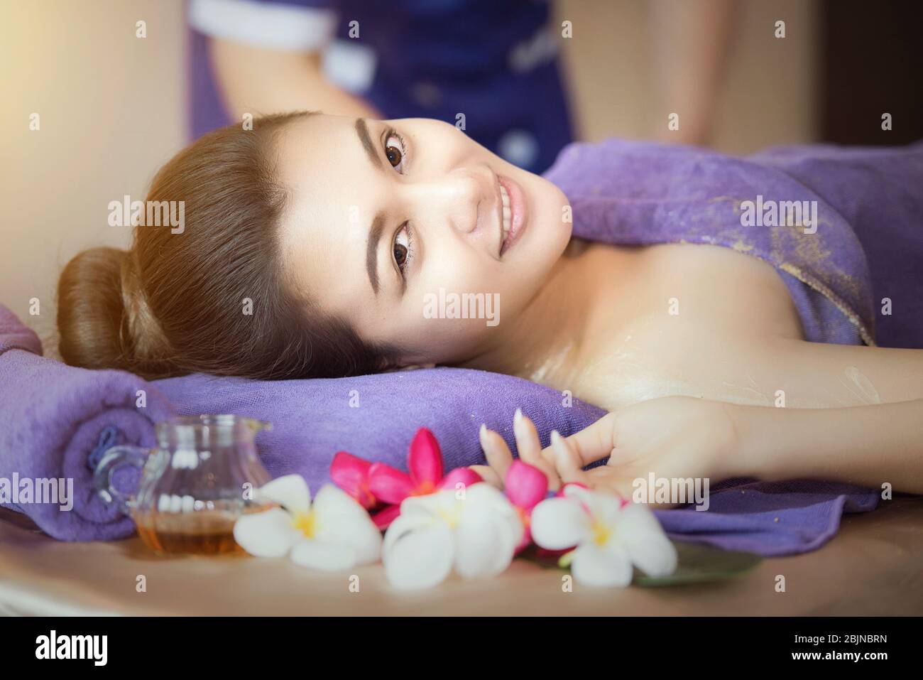Beautiful smiling woman having a spa treatment Stock Photo