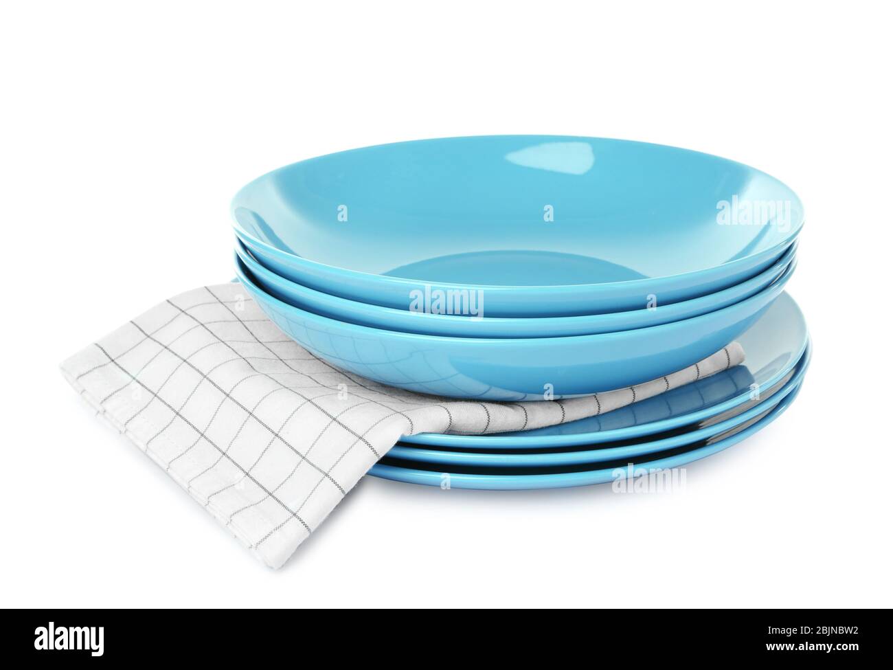 Stack of plates on white background Stock Photo - Alamy