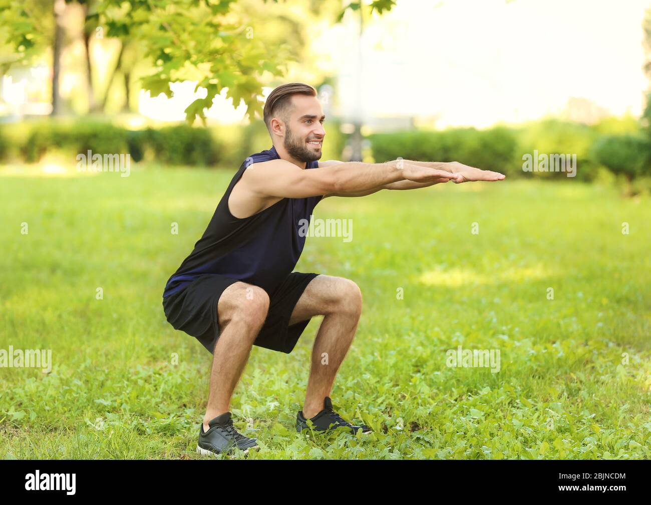 Sporty young man training outdoors Stock Photo - Alamy