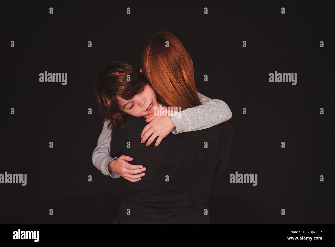 Portrait of a mother hugging her son Stock Photo