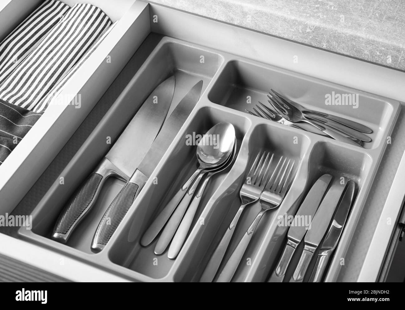 Set of cutlery in kitchen drawer Stock Photo Alamy