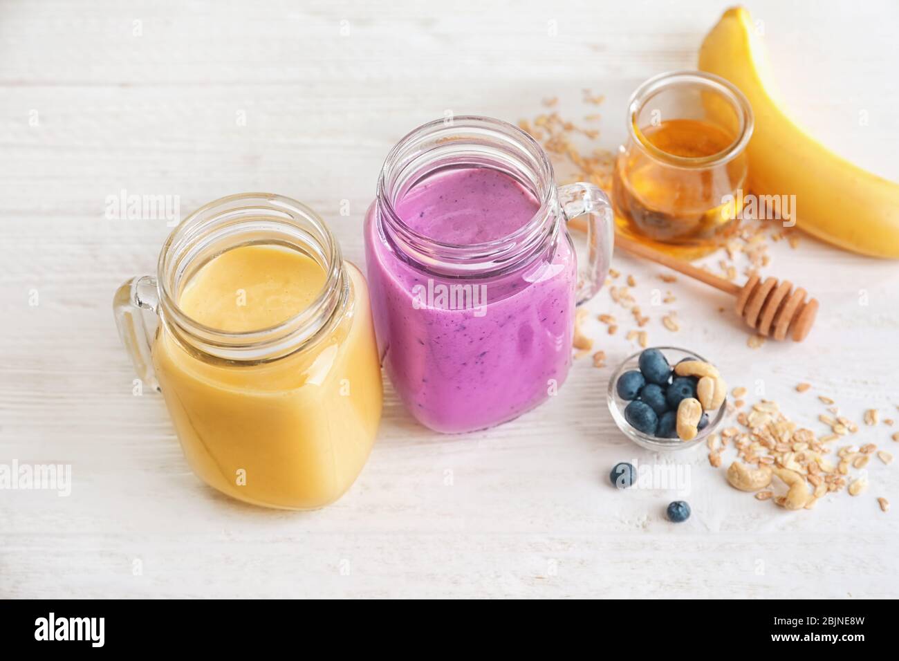 Jars with different protein shakes on table Stock Photo