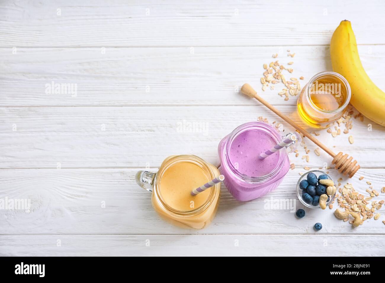 Jars with different protein shakes on table Stock Photo