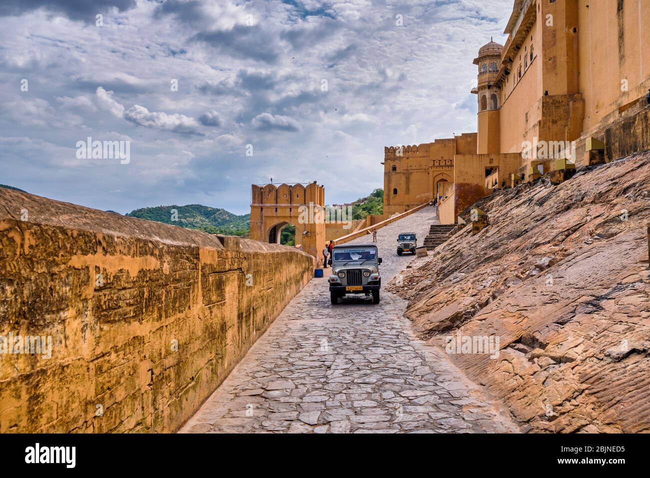 Jaipur, Rajasthan / India - September 28, 2019: Mahindra jeeps transporting tourists to the royal palace at the Amer Fort in Jaipur, India Stock Photo