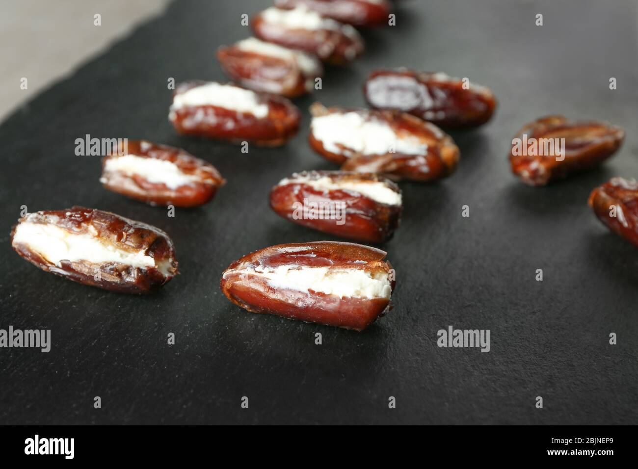 ripe-dates-stuffed-with-goat-cheese-on-slate-plate-stock-photo-alamy