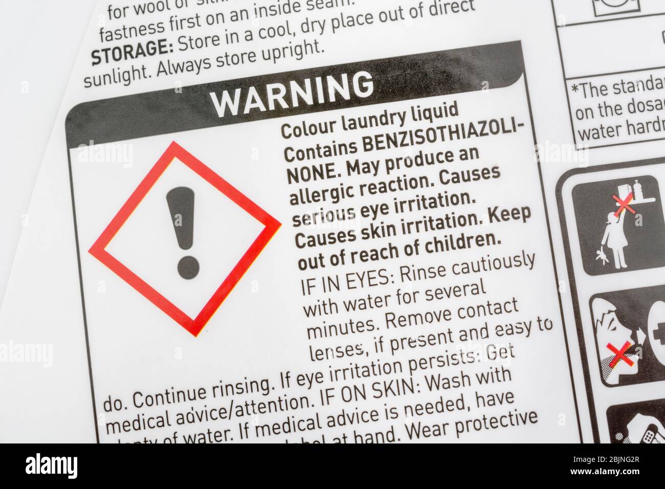 ASDA laundry soap liquid & Exclamation mark hazard symbol for skin, eye or respiratory tract irritant on warning label. Dangerous household products. Stock Photo
