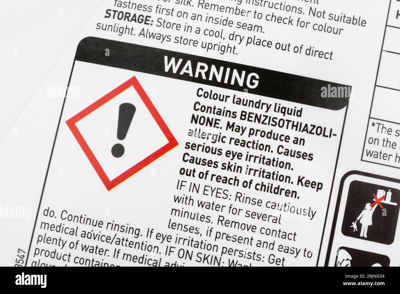 ASDA laundry soap liquid & Exclamation mark hazard symbol for skin, eye or respiratory tract irritant on warning label. Dangerous household products. Stock Photo