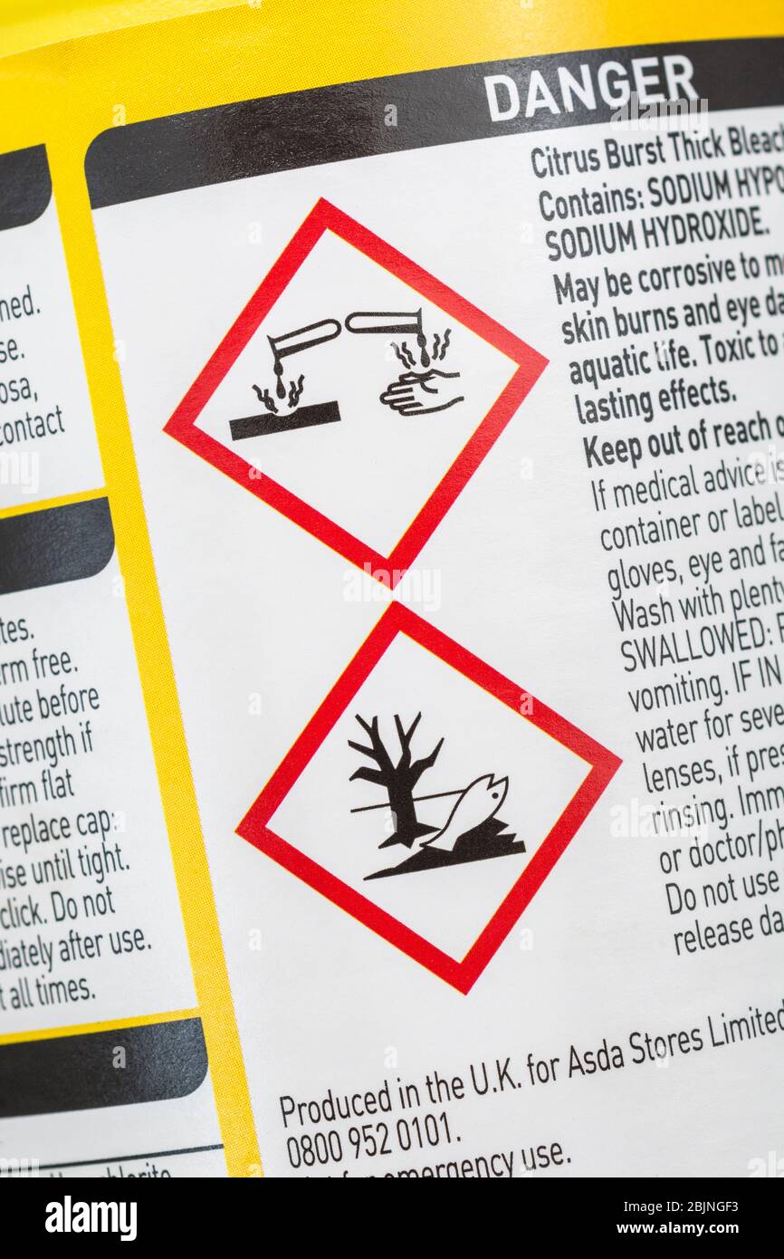 ASDA bleach with GHS warning label for 'chemicals toxic to aquatic wildlife' icon & pictogram for 'materials causing skin burns / metal corrosion'. Stock Photo
