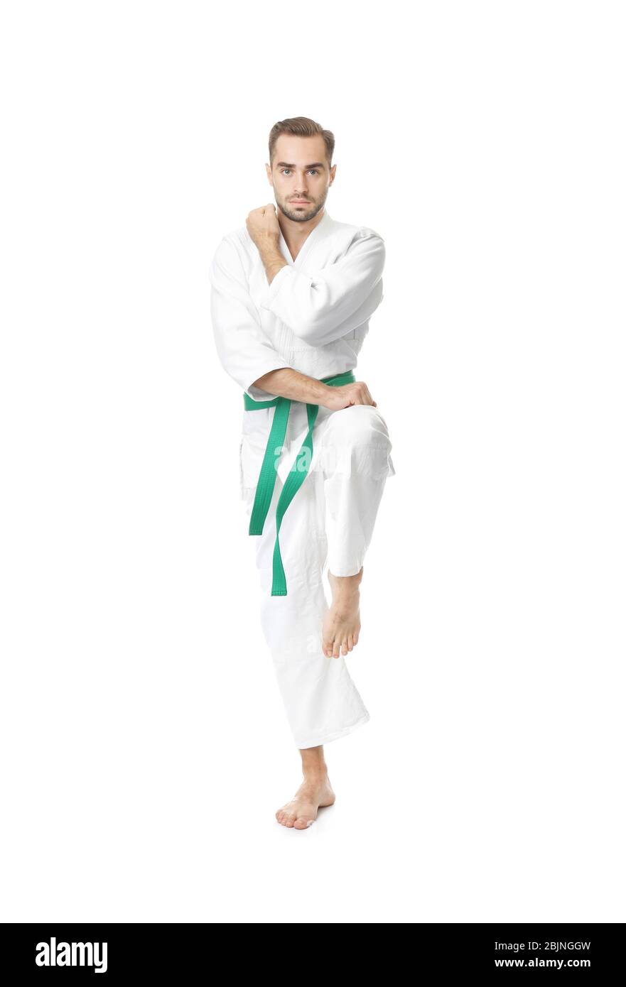 Young man practicing karate on white background Stock Photo - Alamy