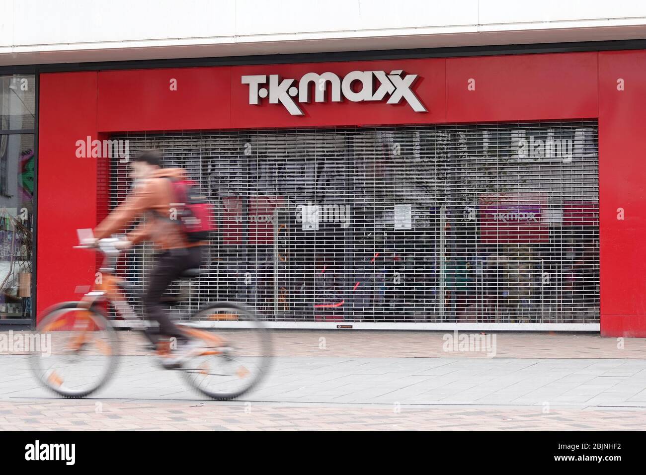Hamburg, Germany. 28th Apr, 2020. A cyclist rides along a closed branch of the department store