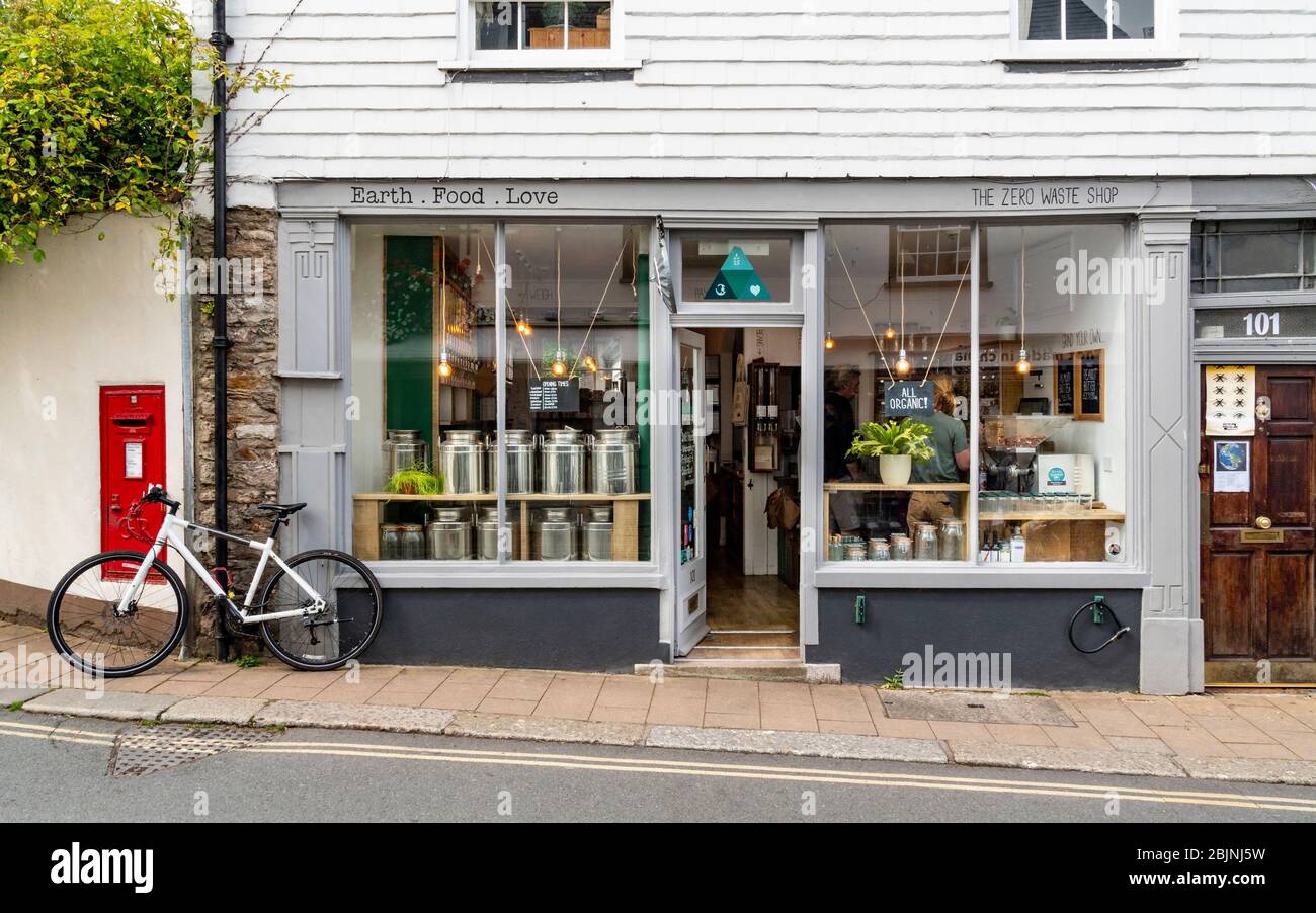 Shop front of a zero-waste, whole food and organic food business on the high street in Totnes, South Devon, England, UK Stock Photo