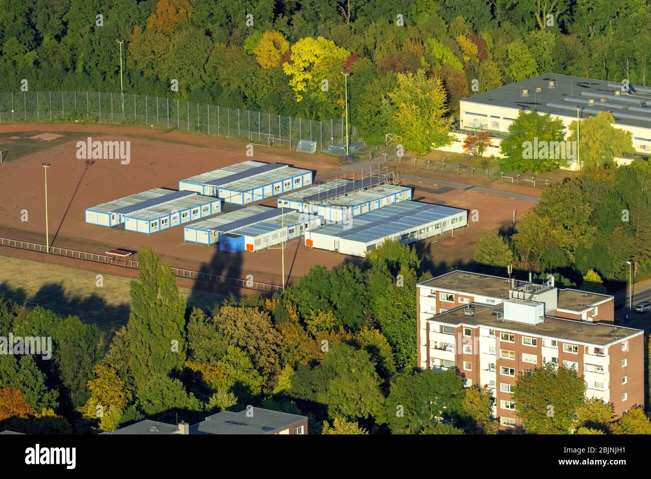 Container settlement as temporary shelter and reception center for refugees on the areal of Gesamtschule Rentfort in Gladbeck, 16.10.2016, aerial view, Germany, North Rhine-Westphalia, Ruhr Area, Gladbeck Stock Photo