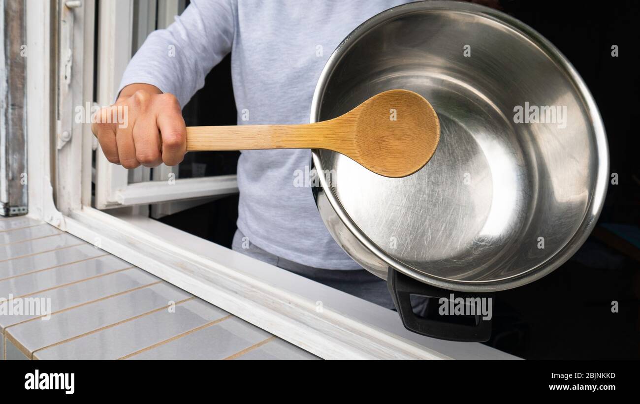 Banging pot with spoon hires stock photography and images Alamy