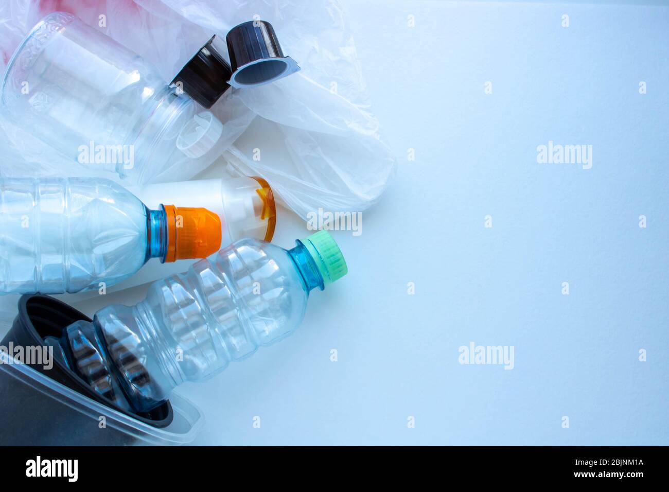 Plastic containers on a white background. The processing of plastics