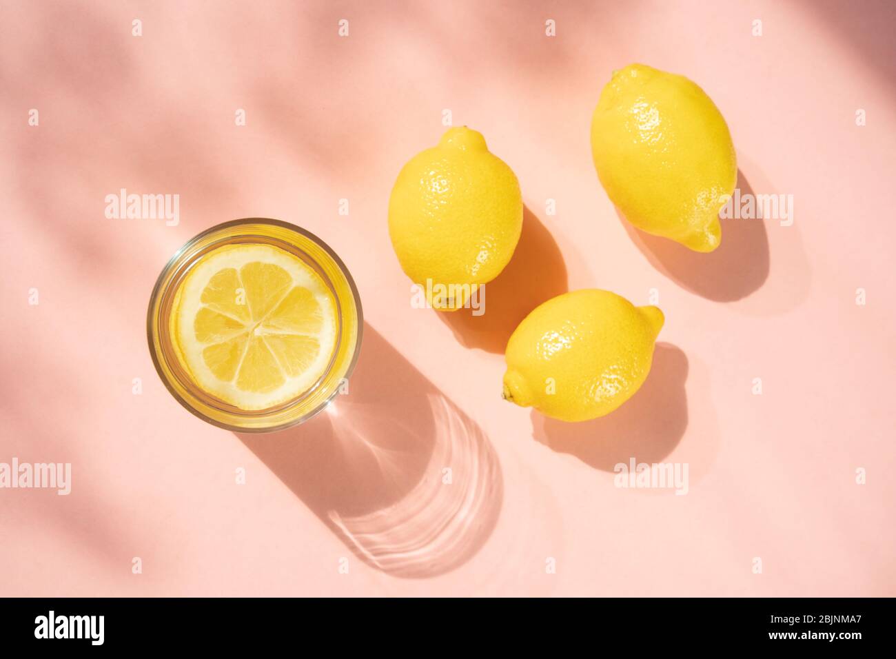 Glass of lemon water with lemons Stock Photo Alamy
