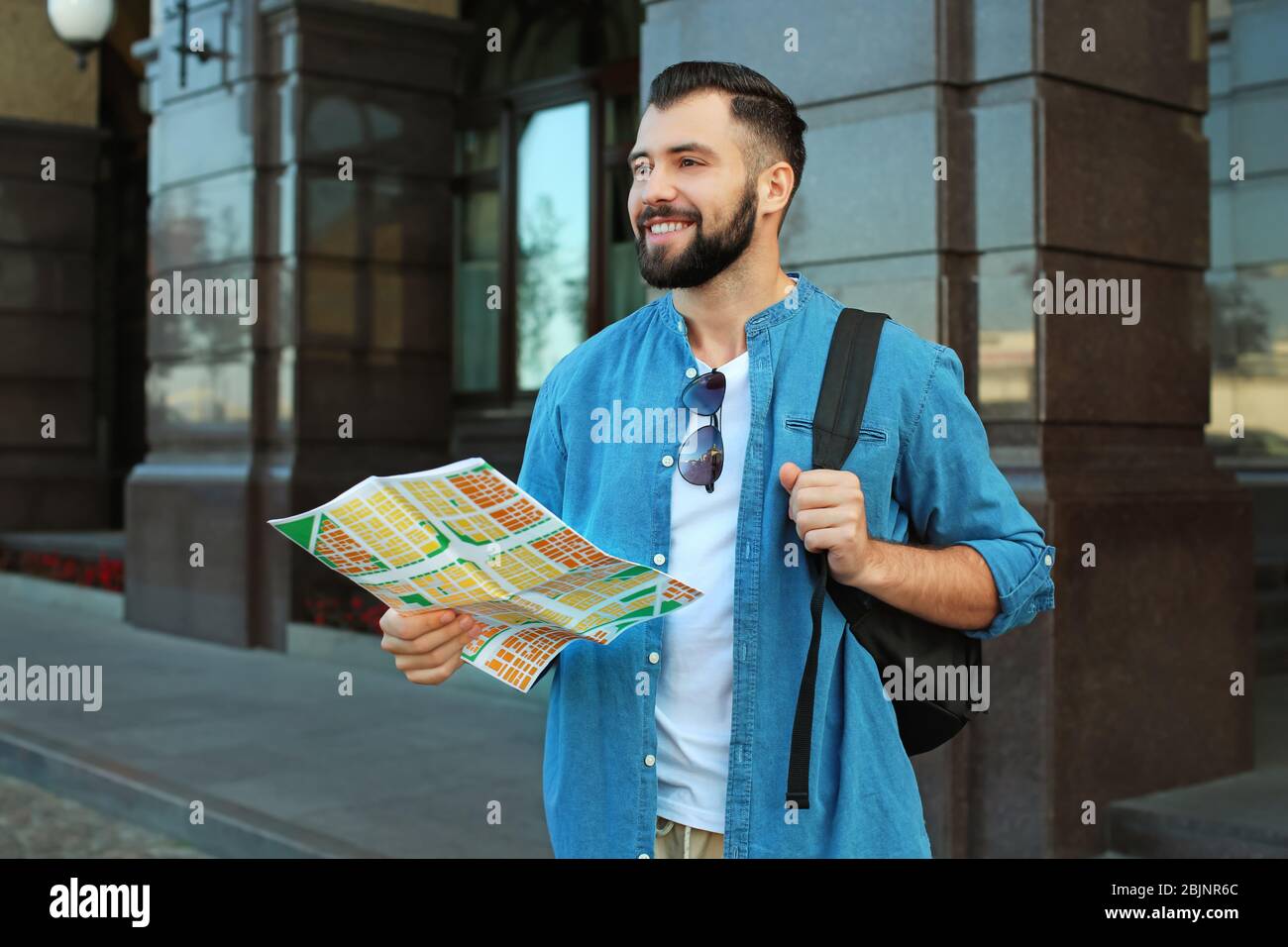 Male tourist with guide map hi-res stock photography and images - Alamy