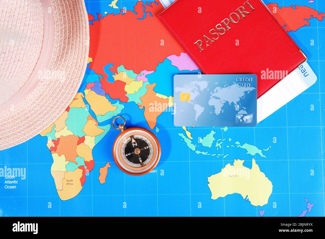 Composition with credit card and passport on world map background Stock Photo