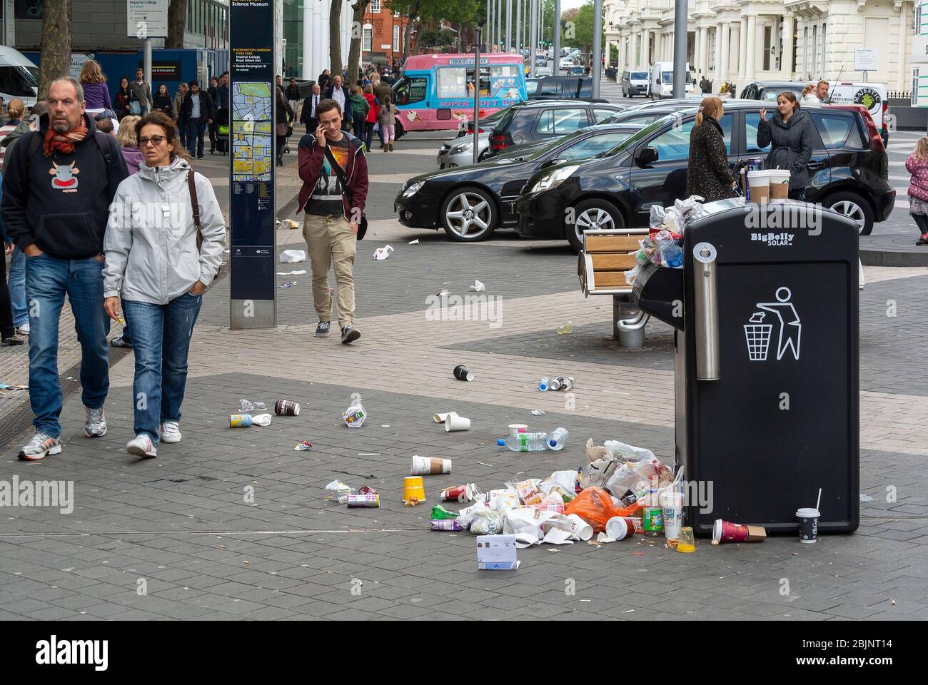 Rubbish overflowing from a bin in central London, UK. Stock Photo