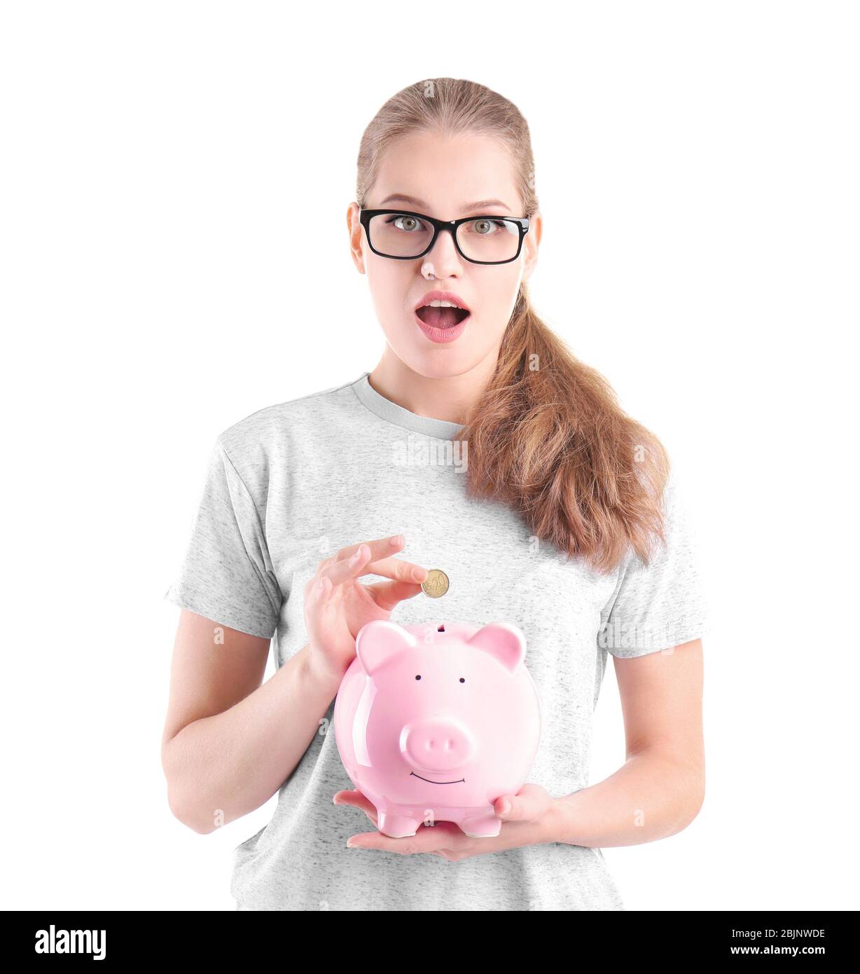 Beautiful young woman with piggy bank on white background Stock Photo ...