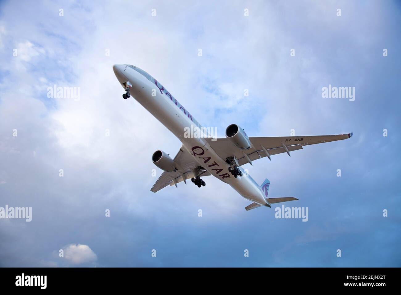 Commercial passenger jet airbus A350 of Quatar Airways landing at the airport. Stock Photo