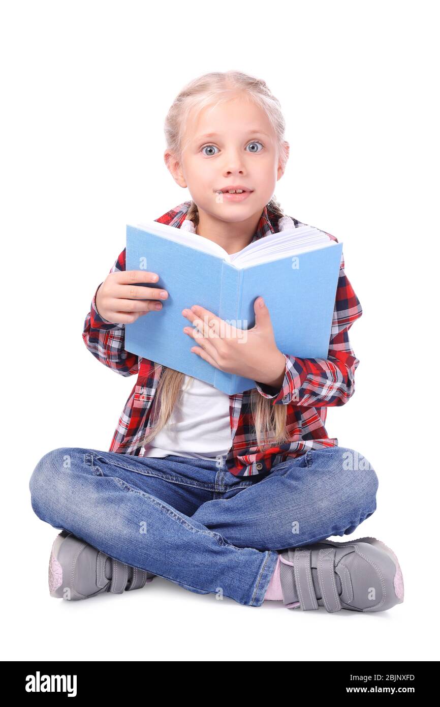 Cute little girl reading book on white background Stock Photo - Alamy