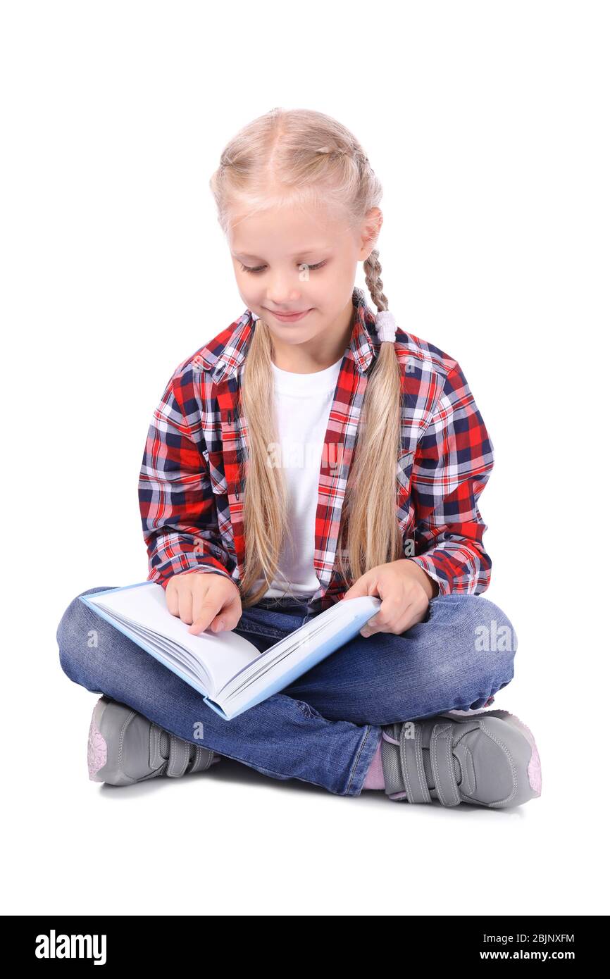 Cute little girl reading book on white background Stock Photo - Alamy