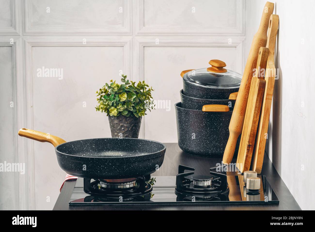 Frying pan on the gas stove in a kitchen Stock Photo Alamy