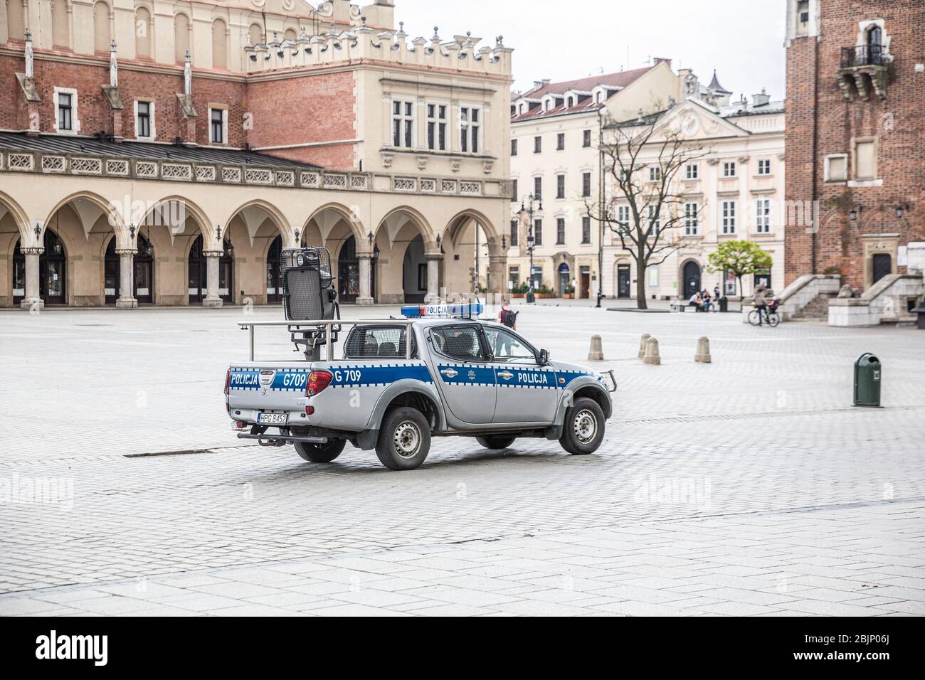 Police car patrol on the Main Square, pandemia time, quarantine in Krakow, Poland, Central Europe Stock Photo