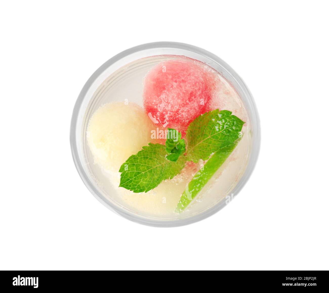 Glass with melon ball drink on white background Stock Photo
