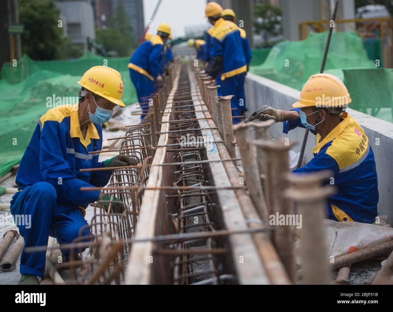 Wuhan, China. 30th Apr, 2020. People work at a construction site of a utility tunnel in Wuhan, central China's Hubei Province, April 30, 2020. The project of utility tunnel here, a passage built to carry utility lines, has resumed construction since the end of March. (Xinhua/Xiao Yijiu) Credit: Xinhua/Alamy Live News Stock Photo