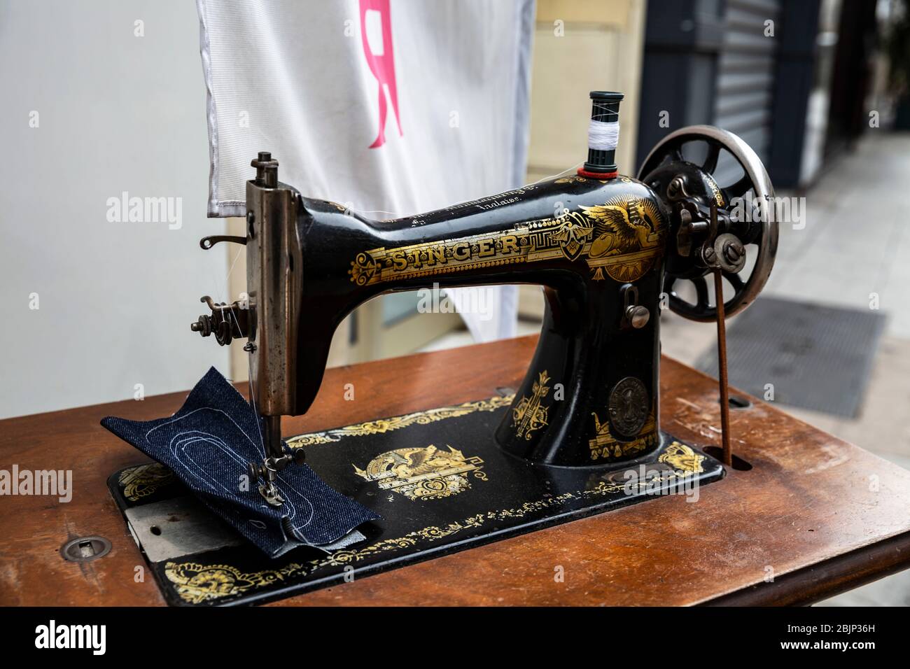 Vintage black and gold Singer sewing machine. Stock Photo