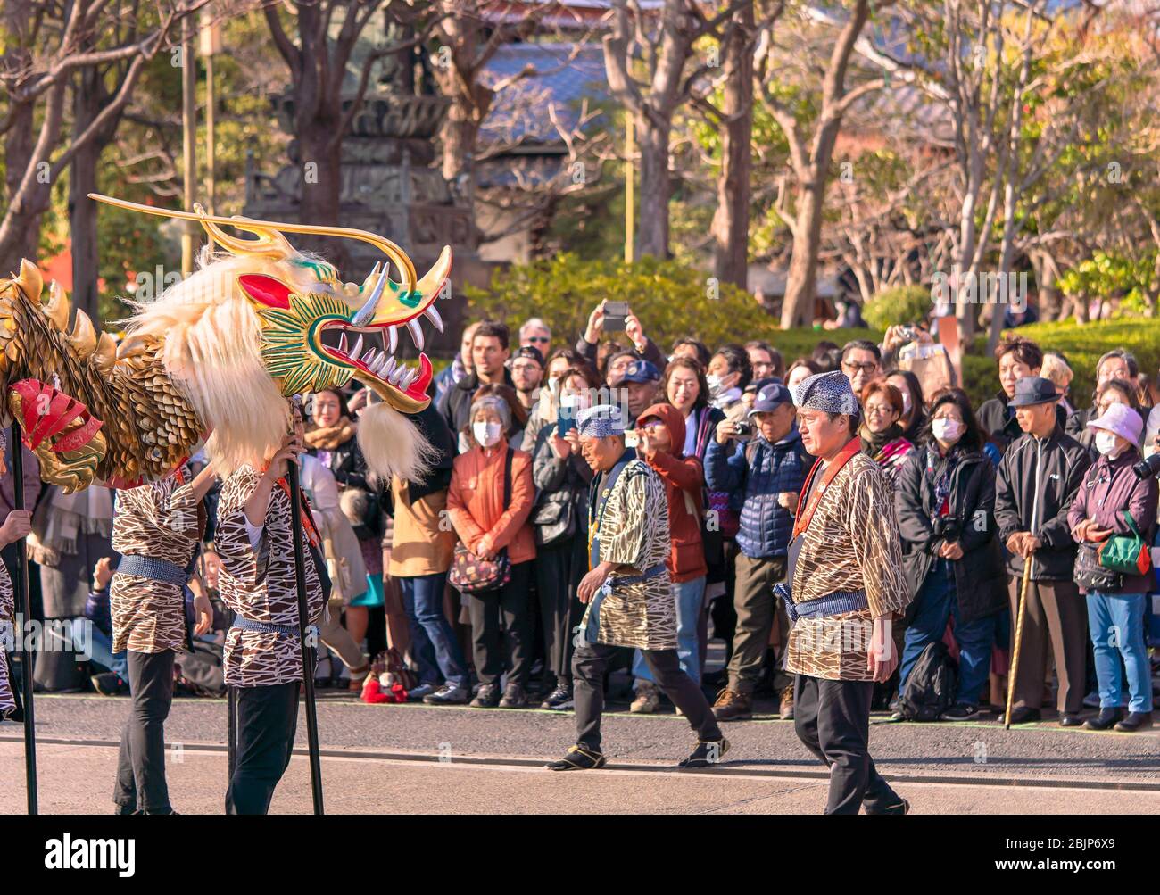 tokyo, japan march 18 2020 Japanese puppet masters holding a golden