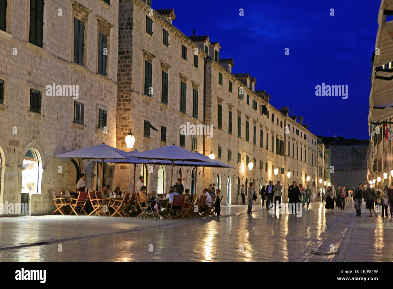 In the evening, the lights turn on in the towers, walls, streets, alleys, shops and sights of Dubrovnik Stock Photo