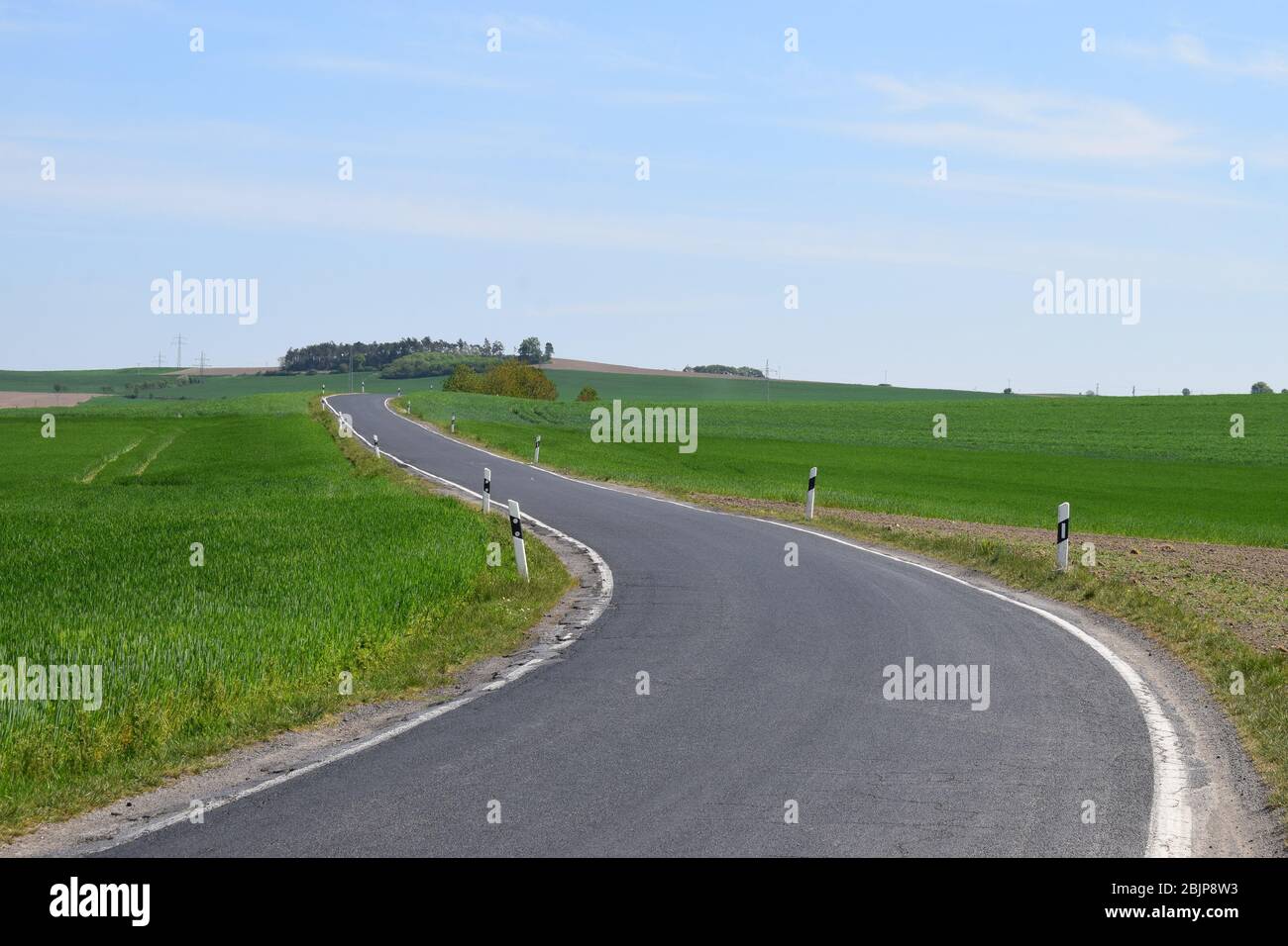 empty road through spring landscape in the Eifel Stock Photo
