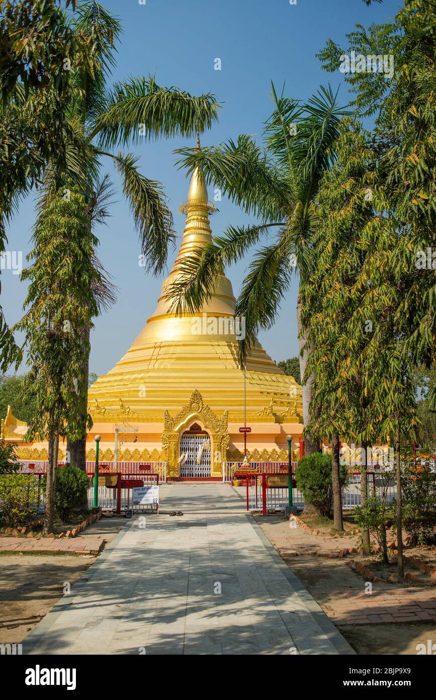 Myanmar Golden Temple on the territory of the Monastic Zone, Lumbini, Nepal. Lumbini is one of the world's most Buddhist spiritual sites and the birthplace of Siddhartha Gautama, the founder of Buddhism. Lumbini Monastic Zone has a number of monasteries and temples build by Buddhist organizations from various countries, have been completed or are still under construction. Lumbini was made a World Heritage Site by UNESCO in 1997. Stock Photo